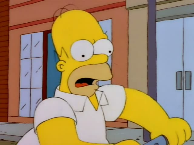 Homer is on a city street lined with brick buildings, using a pneumatic drill with a hose to dismantle a pink car