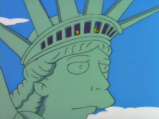 Bart, Marge, Lisa and Maggie look out through the arched windows in the crown of the Statue of Liberty, with Homer and Lisa…