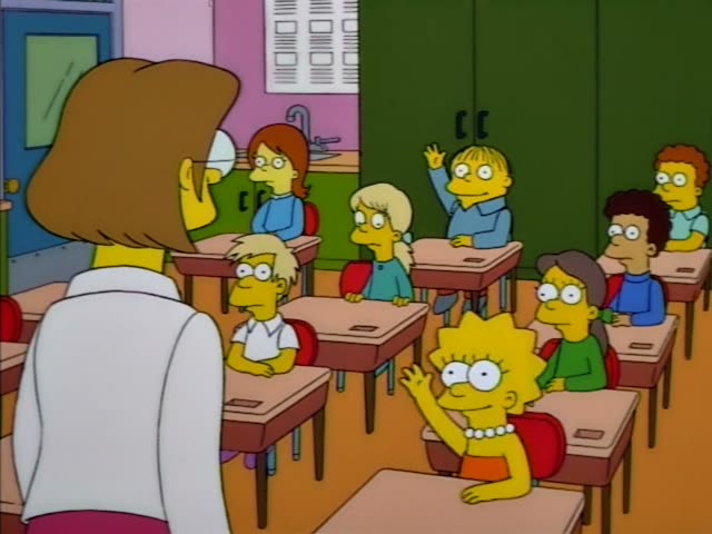 Lisa Simpson sits at a desk in a classroom beside green lockers while her teacher, Miss Hoover stands at the front