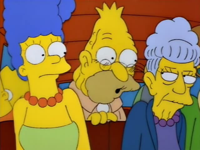 Marge Simpson stands at the left with her tall blue beehive and a flat, unimpressed expression, while Grampa sits…