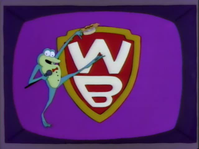 This is the Warner Brothers shield logo on a purple television screen, with an animated green frog-like character in a straw…