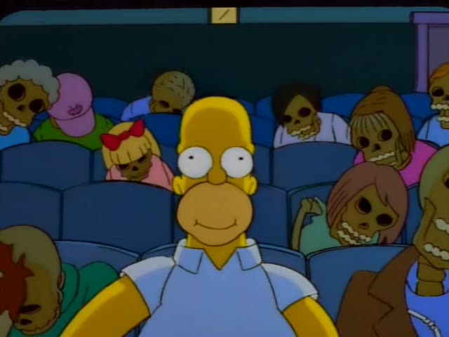Homer Simpson sits among skeleton-like moviegoers in a dim theater, first stuffing his mouth with popcorn with wide eyes…