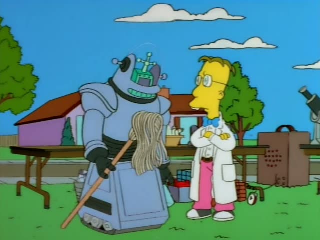 A bespectacled man in a white lab coat, pink trousers and bow tie stands with his arms folded beside a blue robot with a mop…