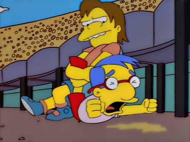 Homer, Marge with baby Maggie, Lisa, and Bart watch from the stadium stands while Carl clutches a dark-haired child…