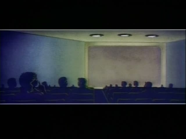 A silhouetted audience of seated figures sits in rows of theater seats in a dim, bluish cinema, with a large blank screen…