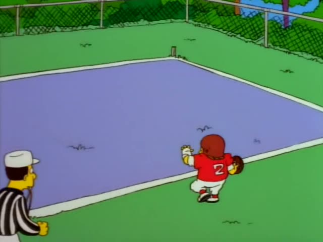 A player in a red number 2 jersey and red helmet runs across a purple fenced field while a striped referee raises his arms…