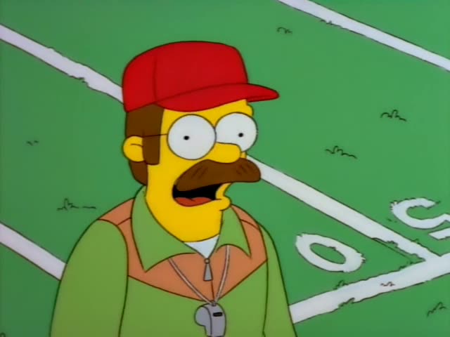 Ned Flanders stands on a sports field with a whistle around his neck, first scowling and then grimacing as he stomps off…