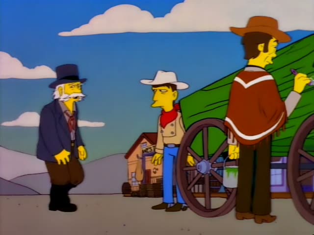 Three one-off characters stand in a Western-style town street: an elderly white-haired man with a long white moustache…