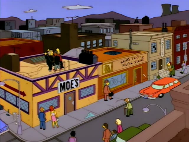 A crowd of yellow cartoon characters first gathers on the roof of Moe's bar on a street lined with shops, a hotel sign…
