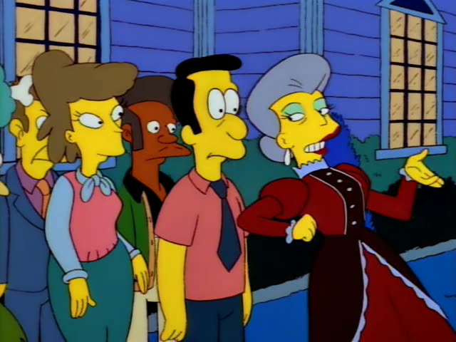Outside a purple clapboard house with bushes and windows, a row of onlookers stands on a sidewalk: a suited man…