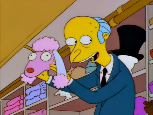 Mr. Burns first fiddles with a pink poodle-headed puppet in a cluttered clothing shop lined with coats on racks, then puts…