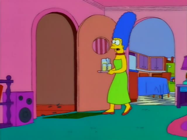 Marge carries a tray of lemonade glasses and a pitcher from the kitchen archway into the pink living room, pausing…