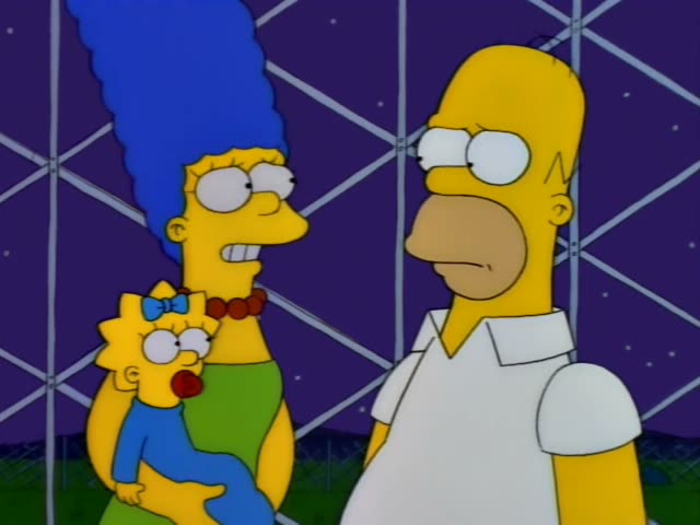 Marge Simpson holds Maggie, the baby with a blue bow and pacifier, on her hip while standing beside Homer, the bald, heavy…