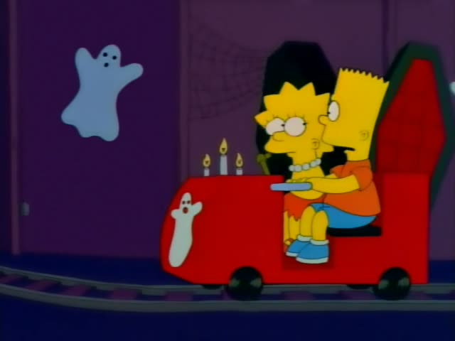 Lisa and Bart ride together in a small red cart on a dark ghost-train track through a purple Halloween haunted house…