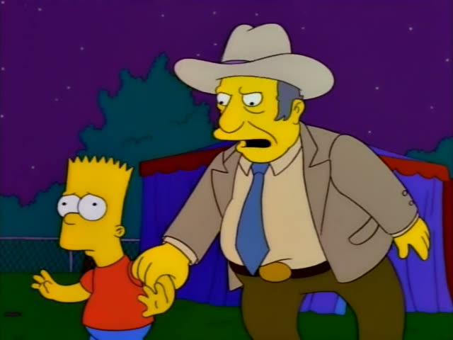 Bart stands at the left beside a heavy, brown-suited man in a wide cream cowboy hat and blue tie, who is not one…