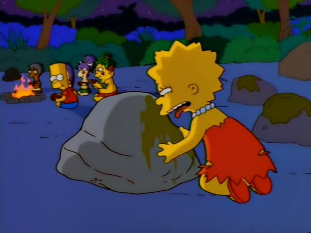 Lisa kneels at a grey boulder streaked with green slime on a blue-grey clearing at night, where children in primitive dress…