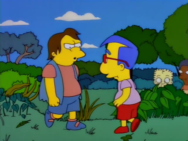 Nelson and Milhouse stand on a grassy path among bushes and trees