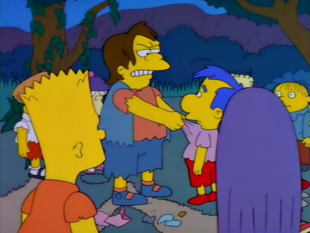 Nelson grips Milhouse by the shirt while Bart watches from the foreground in a dusky clearing littered with trash