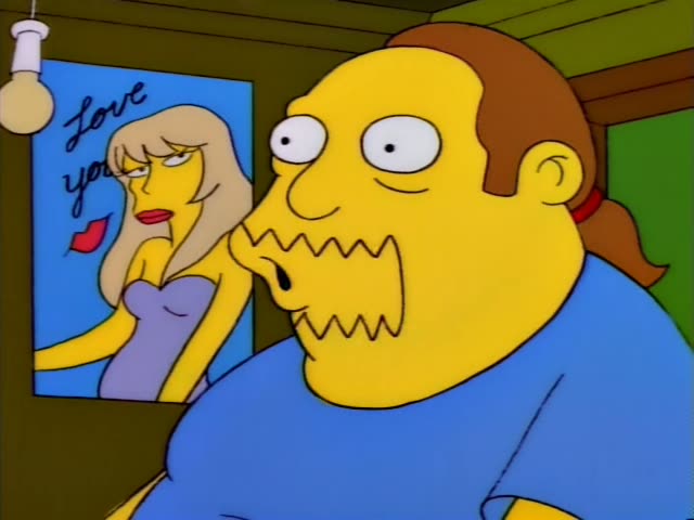 Homer sits at a table in a pink room with a green teapot, pencils, and a red drink, speaking and looking sideways