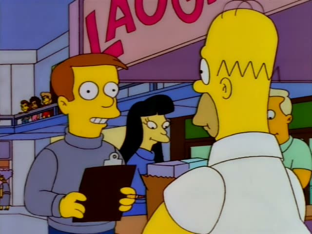 Homer in his white shirt, holding a brown paper bag, stands near a pink booth marked 'Laughs 'Til You Care'…