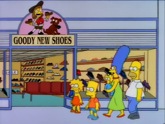Bart and Lisa stand outside the Goody New Shoes store in a shopping mall, with Homer, Marge and baby Maggie nearby…
