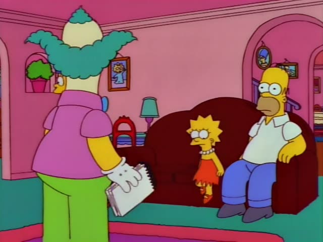 Krusty the Clown stands in the pink living room and faces Homer, who is seated on a dark red couch in a white shirt and blue…