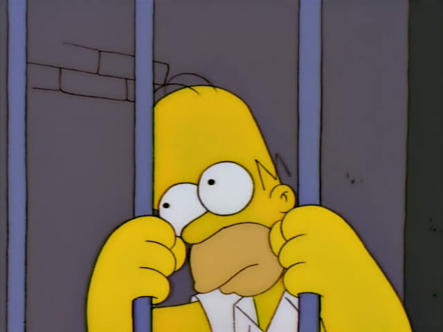 Homer first grips the bars of a jail cell with both hands, looking anxious and wide-eyed, then sinks his face…