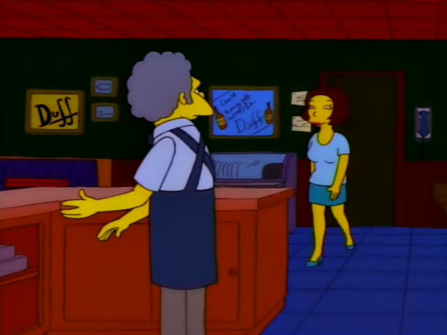 Moe stands behind the bar under Duff signs and first turns away with his hands raised, then faces a woman with a short…