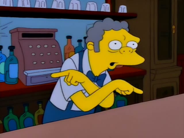 Moe stands behind the bar in a Moe's-style tavern lined with bottles and a cash register, first pointing and gesturing…