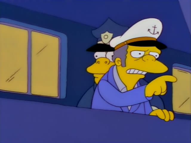 Mr. Burns stands at a railing beside a police officer with a blue cap and badge, who is a fat police chief in a dark uniform