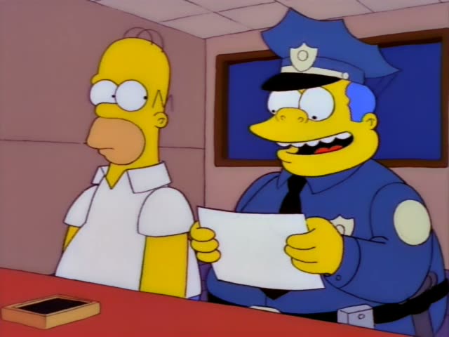 Homer and Chief Wiggum sit at a desk in the police station, with Wiggum holding a sheet of paper and grinning as he talks…