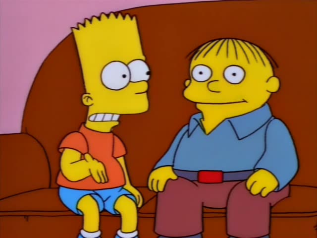 Bart Simpson and a chubby boy in a blue collared shirt, maroon pants and a red belt sit together on a brown couch in a pink…