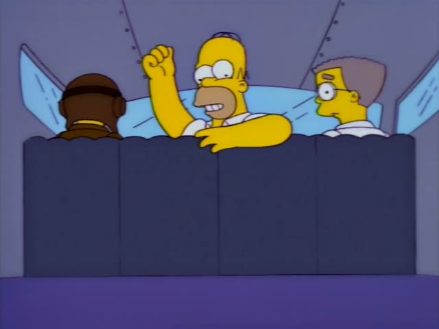 Homer sits in the middle of a plane cabin row between Carl and an unnamed man with short brown hair on the right; Homer…