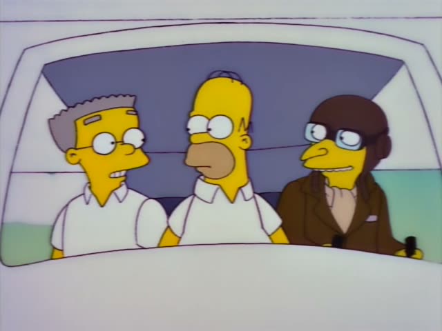 Inside the cockpit viewed through the windshield, Smithers with grey hair and glasses sits at left, Homer in a white shirt…