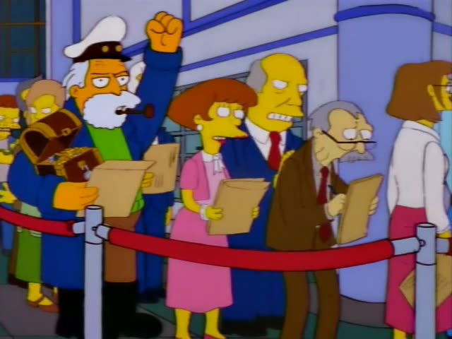Chief Wiggum stands on the tiled floor of the Springfield Post Office and addresses a crowd of townspeople waiting in a line…