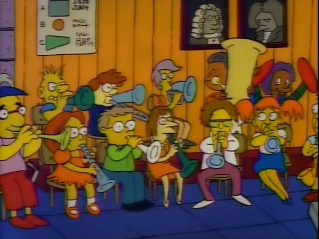 In a crowded school band room, Lisa Simpson in her orange dress plays a saxophone while Mr. Burns conducts the students…