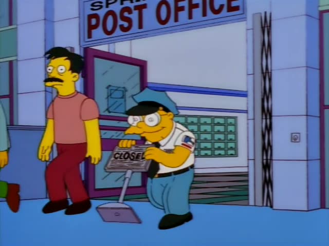 Chief Wiggum sets a CLOSED sign outside the Springfield Post Office as two men walk past, one in a teal sweater and green…