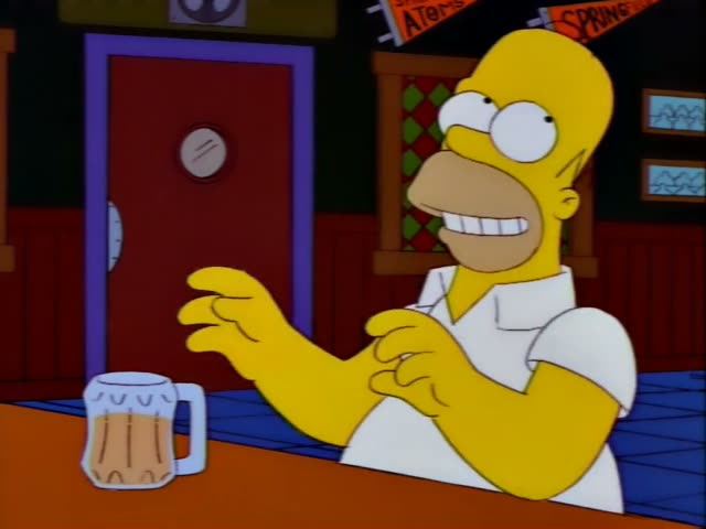 Homer Simpson sits at the bar of Moe's Tavern holding a frosty mug, then leans back with his hands on his head as a thin man…