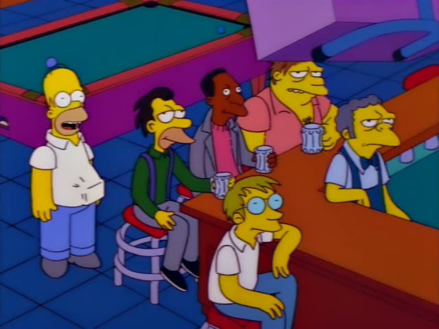 Homer stands at the left by a pool table while Lenny, Carl and a heavy man with messy brown hair in a pink shirt sit or lean…