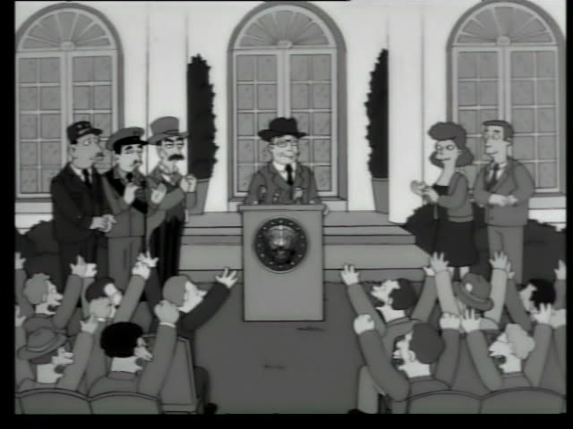 A crowd of unnamed men in black-and-white raise their hands and cheer while a man in a dark hat speaks at a seal-marked…