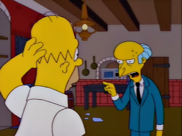 Homer stands in a kitchen with a red brick wall and hanging pans, scratching his head with one hand while Mr. Burns points…