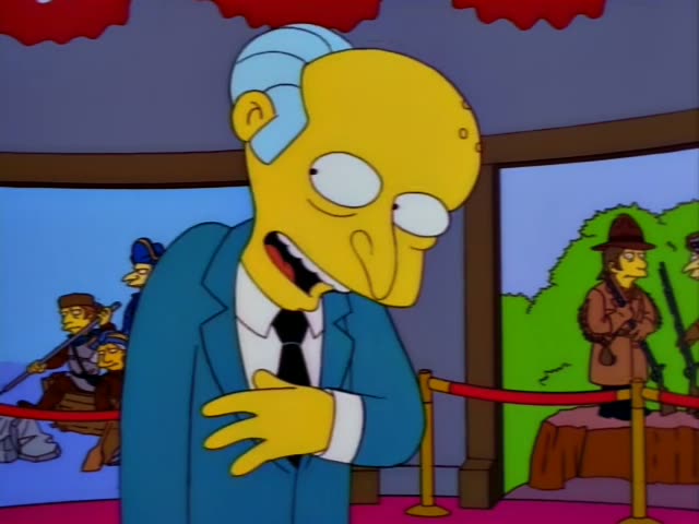 Mr. Burns fidgets beside a red velvet rope in a display hall with dioramas behind him, then pulls a brown wallet…