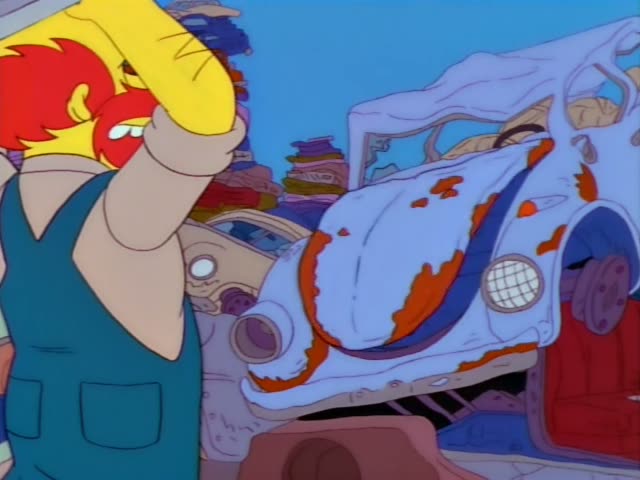 A red-bearded, bald man in blue overalls and yellow gloves, identified by the dialogue as Groundskeeper Willie, raises…