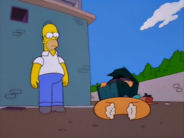 Homer stands beside a teal brick wall in an alley while Grampa's white-tufted head sticks out from a green dumpster…