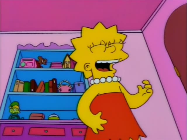 Lisa Simpson laughs and gestures in her pink bedroom beside a light blue shelf holding books, toys and a small pink handbag…