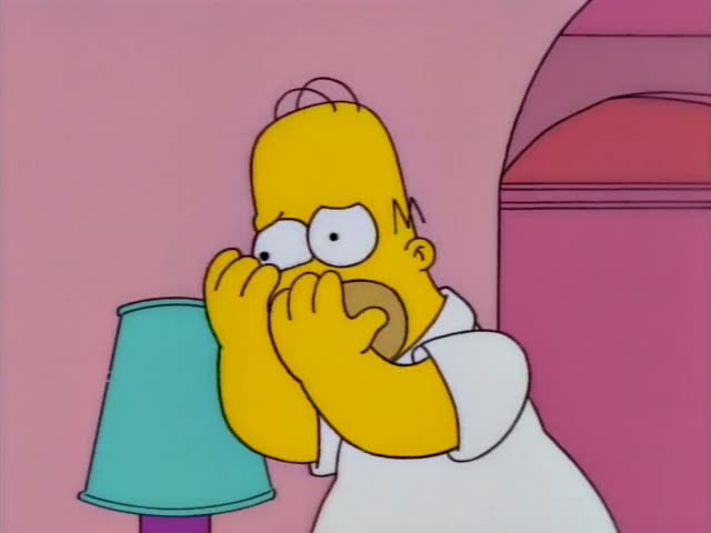 Homer and Marge are in the pink living room, with Lisa, Maggie, Bart and the black cat Snowball II on the couch