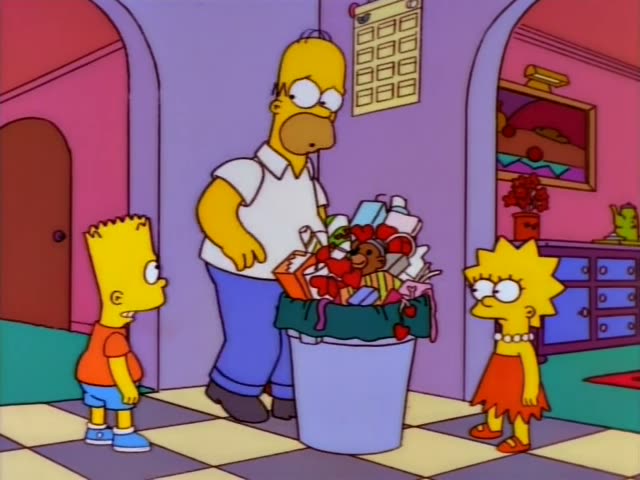 Homer Simpson stands in a purple hallway beside a white trash can overflowing with wrapped presents, boxes and red…