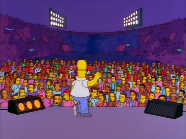 Homer walks onto a purple-lit stage before a packed crowd, raising one arm to them