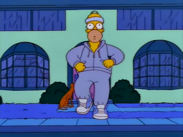 Homer Simpson is pulled along a blue sidewalk outside a house by Santa's Little Helper, the brown greyhound, which is…