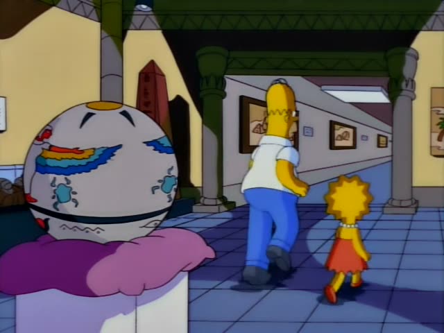 Homer and Lisa walk away down a tiled corridor lined with framed Egyptian-style pictures of pyramids, past a large…